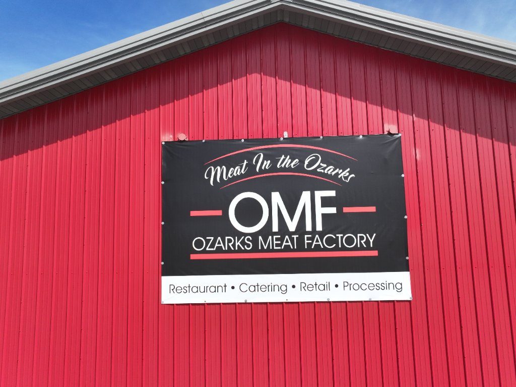 Ozarks Meat Factory sign on the red barn